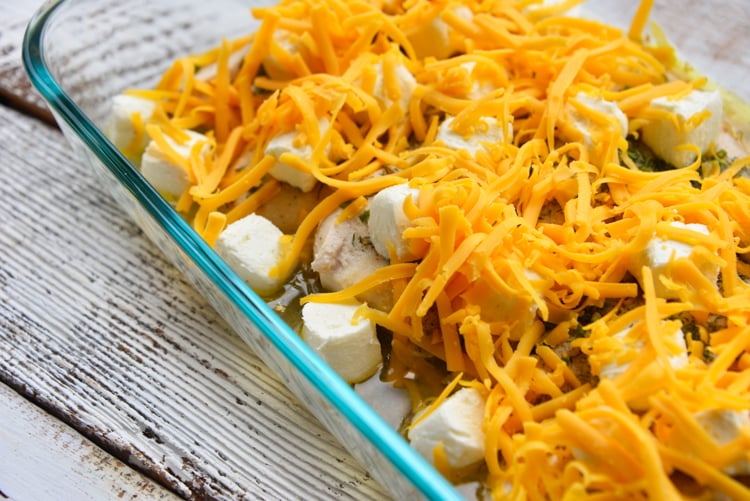 baked crack chicken topped with cream cheese and shredded cheese