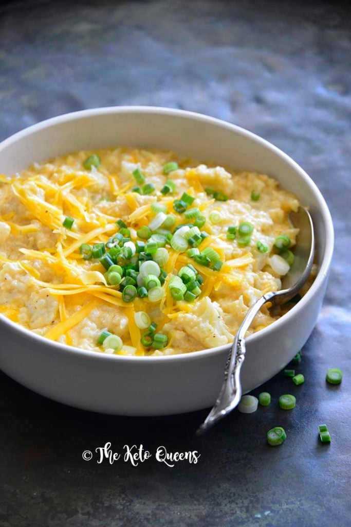 keto mac and cheese recipe in a white bowl topped with scallions