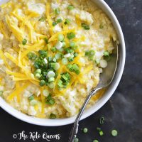 keto mac and cheese recipe in a white bowl topped with scallions