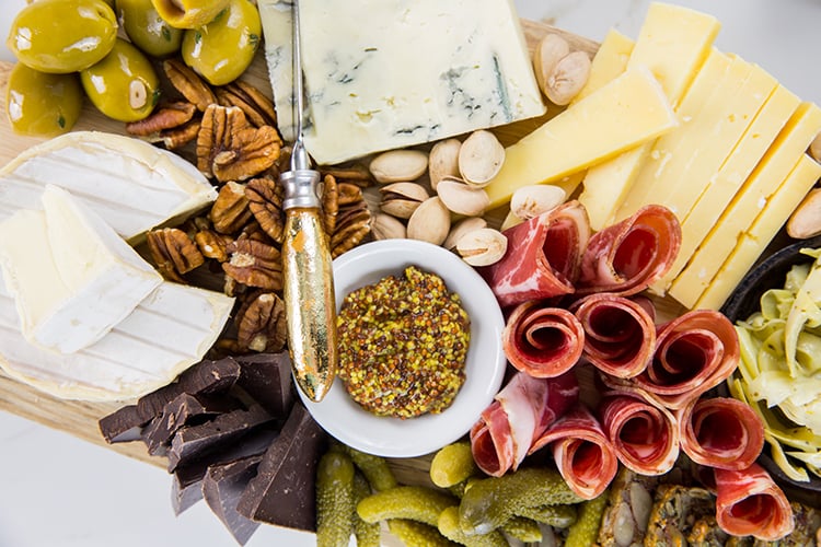 Cheese Board with Brie Cheese Blue Cheese and White Cheddar