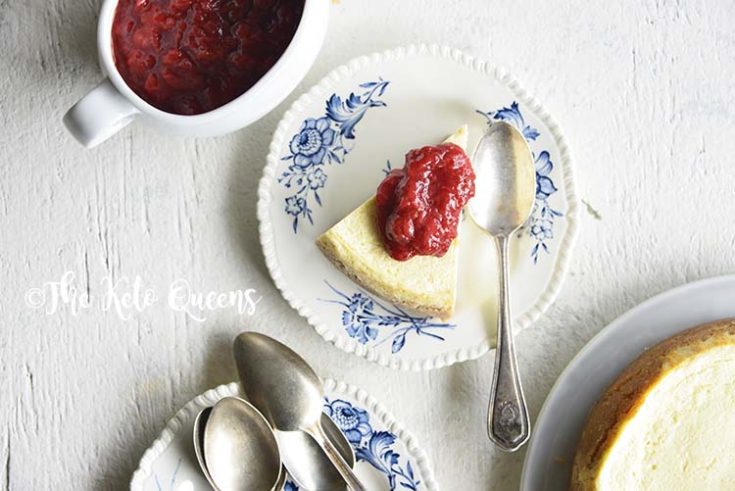 low carb instant pot cheese cake with easy strawberry sauce on a white background