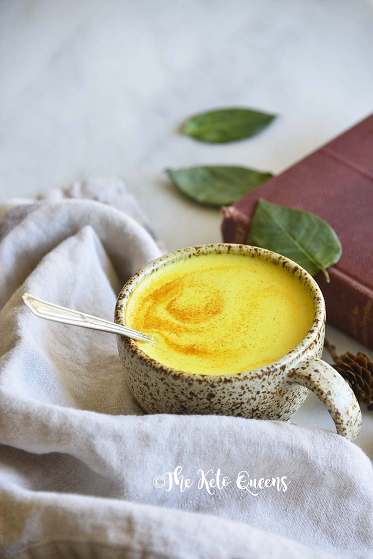 Front View of Golden Milk with Linen on Marble Counter