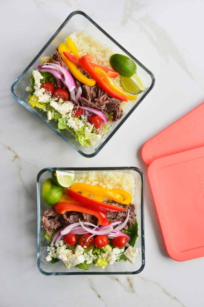 2 prepared keto chipotle bowls in square glass meal prep containers with lids