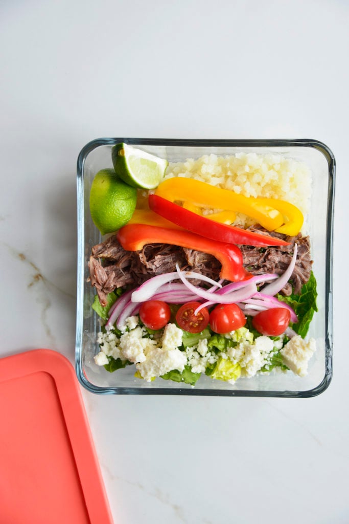 Prepared keto chipotle bowls in square glass meal prep containers with lid