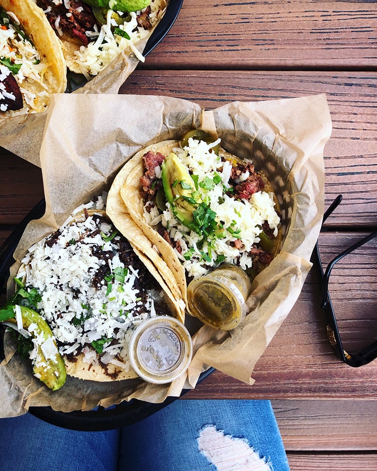 Overhead Shot of Torchy's Tacos on Wooden Table with Sunglasses