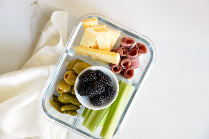 Charcuterie and cheese is a quick and easy keto meal prep idea! Pack some charcuterie meats, cheese, pickles, olives, and celery in your favorite meal prep container. It'll make for a delicious, grab and grow lunch.