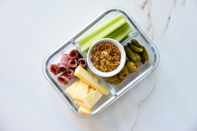 Charcuterie and cheese is a quick and easy keto meal prep idea! Pack some charcuterie meats, cheese, pickles, olives, and celery in your favorite meal prep container. It'll make for a delicious, grab and grow lunch.