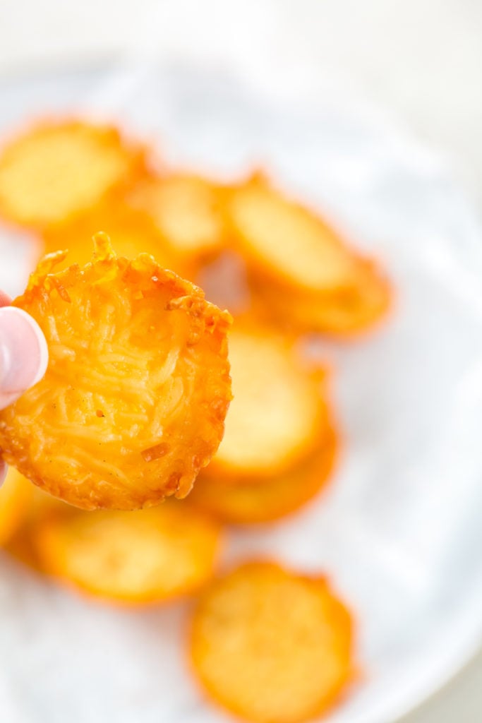 keto parmesan crisps being held