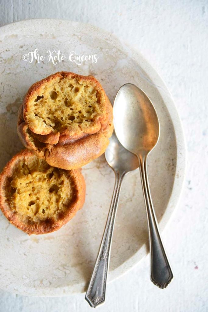 vertical image from above of Low Carb Brioche Bread with 2 spoons split open