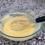 batter in clear bowl with whisk