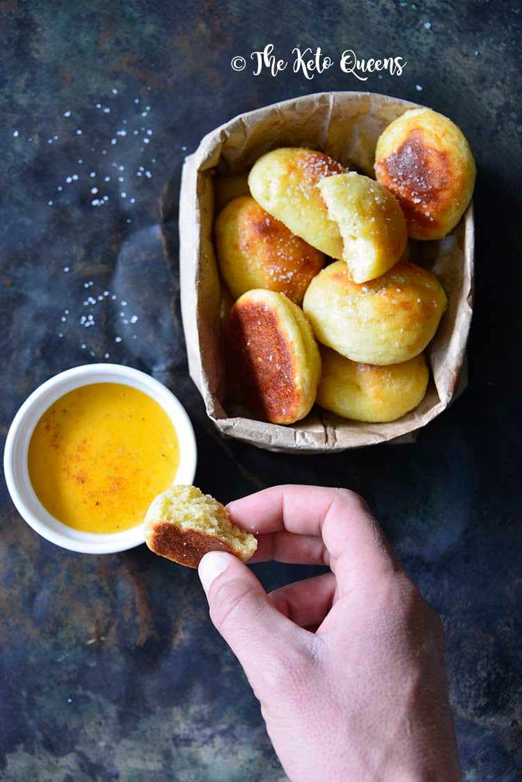 Low Carb Soft Pretzel Recipe (Keto Pretzel Bites) with Beer Cheese and Hand Reaching In
