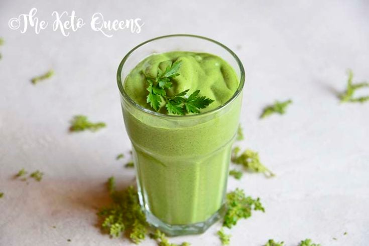 detox keto green smoothie in a clear cup with parsley on top