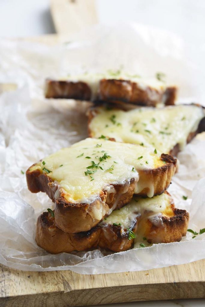 low carb Texas toast on a parchment paper topped with parsley