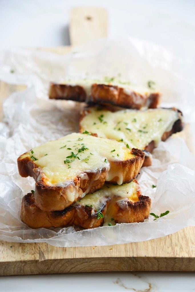 low carb Texas toast on a parchment paper topped with parsley