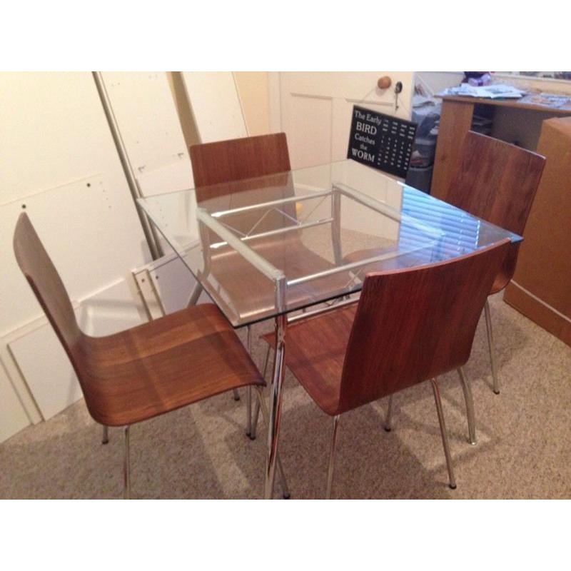 Glass dining table with 4 wooden chairs
