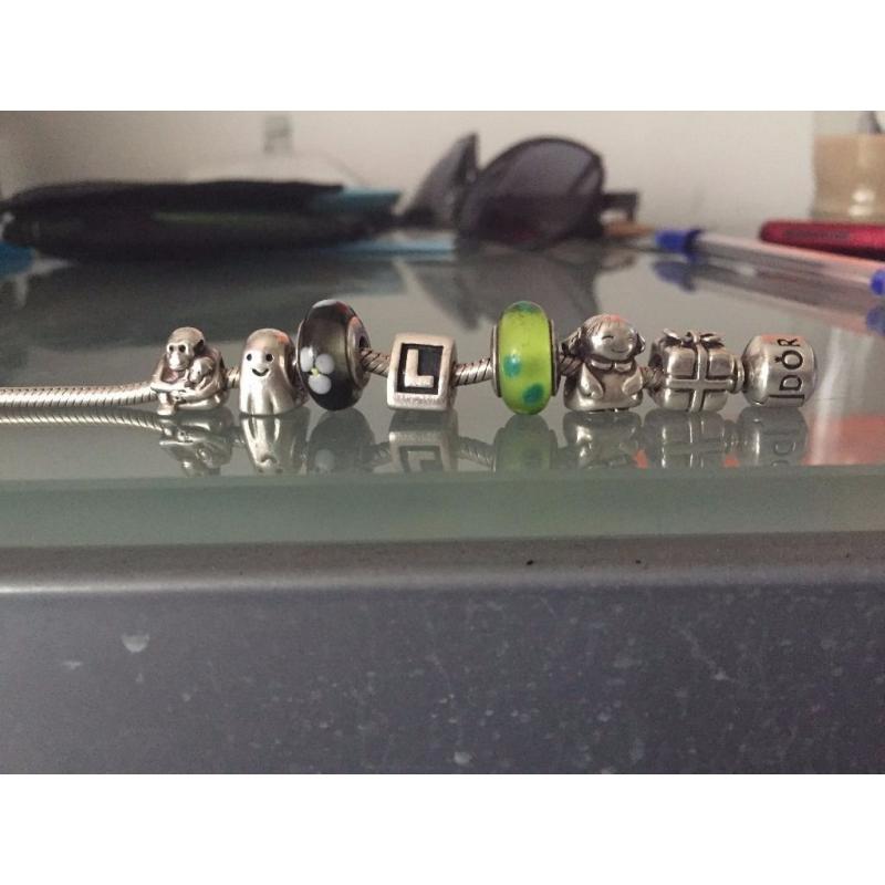 Authentic Silver Pandora Bracelet with 7 charms, all of them have 925 ALE as authenticity proof
