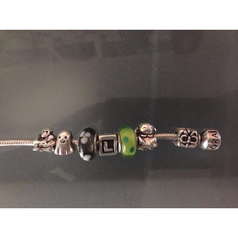 Authentic Silver Pandora Bracelet with 7 charms, all of them have 925 ALE as authenticity proof
