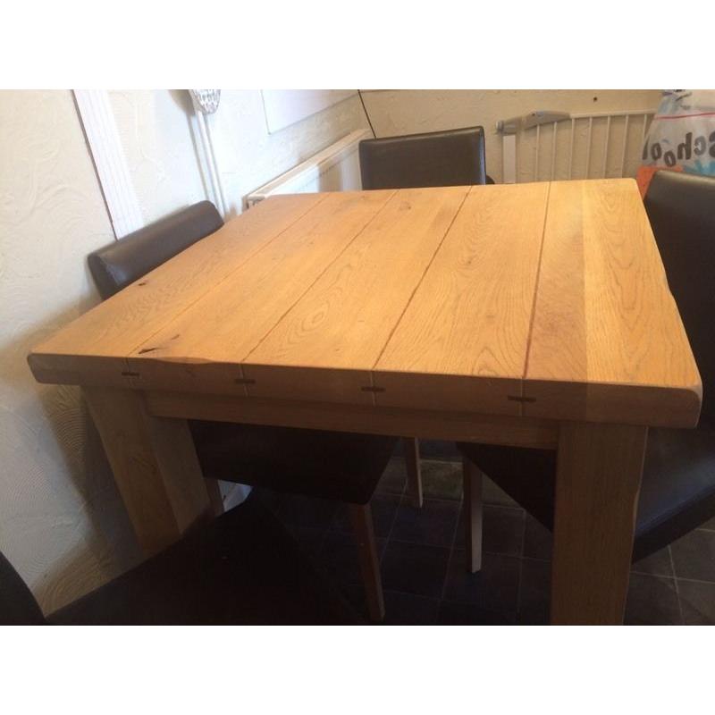 Bespoke oak dining table and chairs