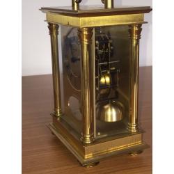 Large brass carriage clock strikes on bell