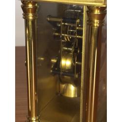 Large brass carriage clock strikes on bell