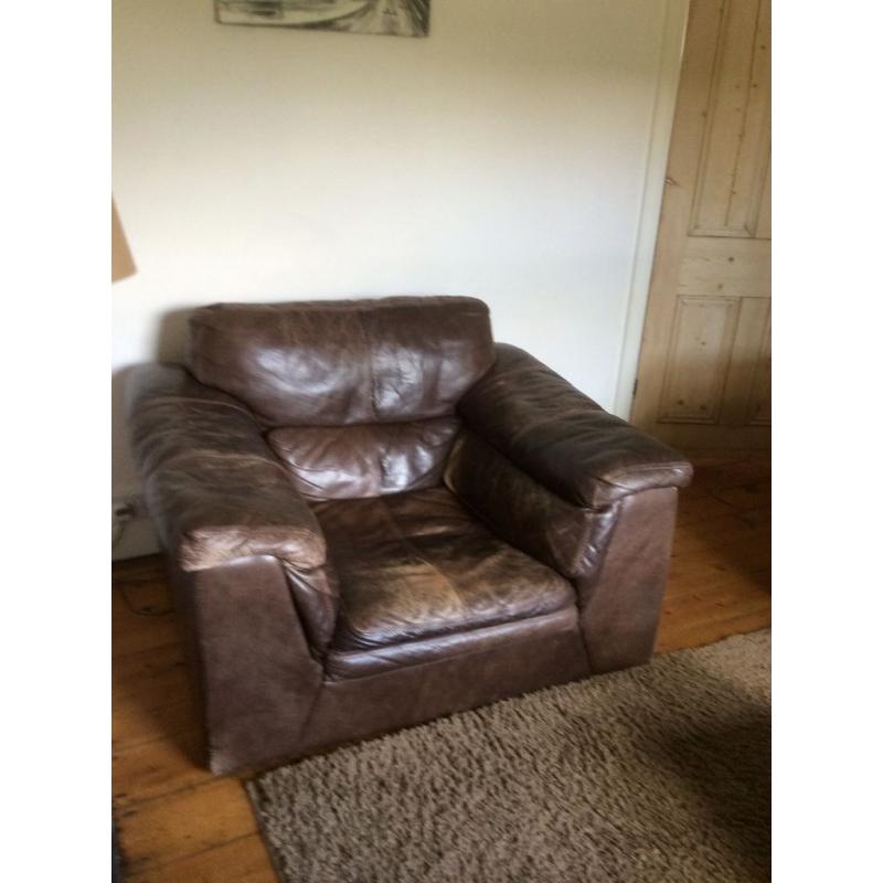 Comfy and roomy brown leather armchair