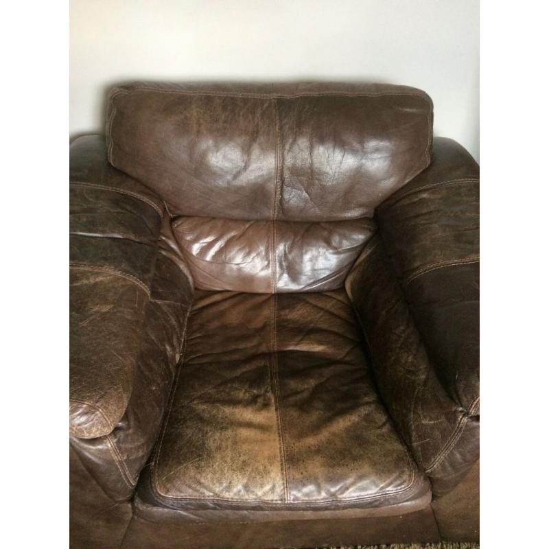 Comfy and roomy brown leather armchair