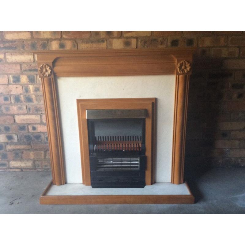 Solid wooden surround with built electric fire