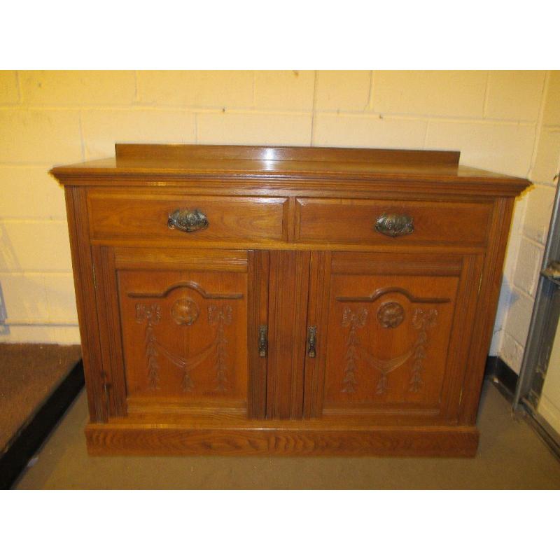 VINTAGE SOLID OAK TWO DRAWER SIDEBOARD WITH CARVED DOORS FREE DELIVERY