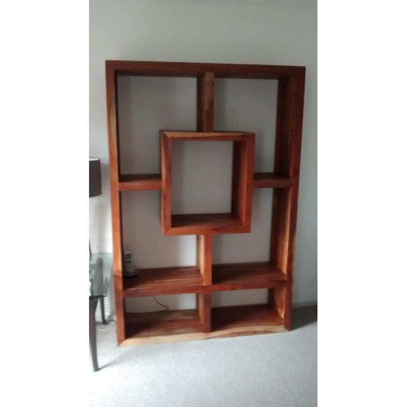 unuseual decorative wall unit in solid heavy grained wood.
