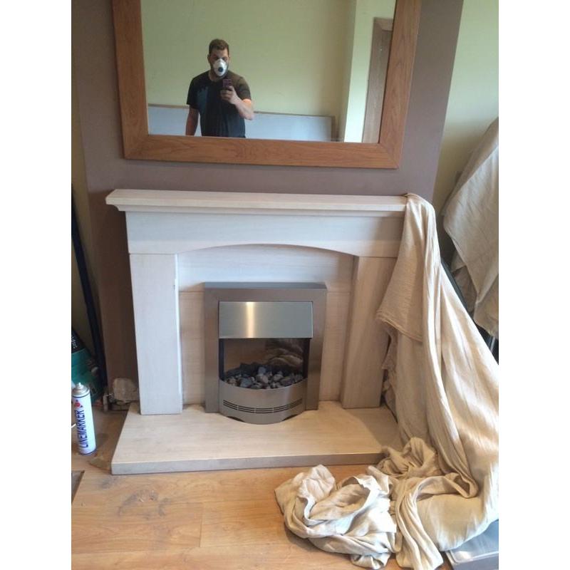 Limestone fireplace with electric fire