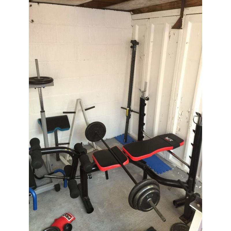 Red and Black heavy duty weight bench with 7ft bar