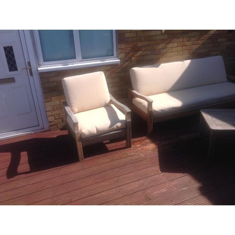 Solid teak garden set, bench two chairs table including cushions. Cushions need attention.