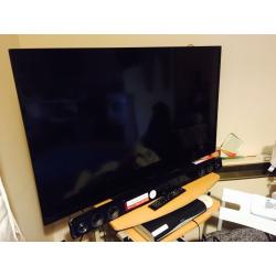 TV in great condition, less than one year old, with soundbar, quality as new
