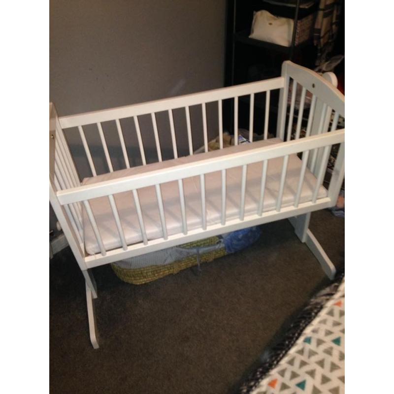white swinging baby crib