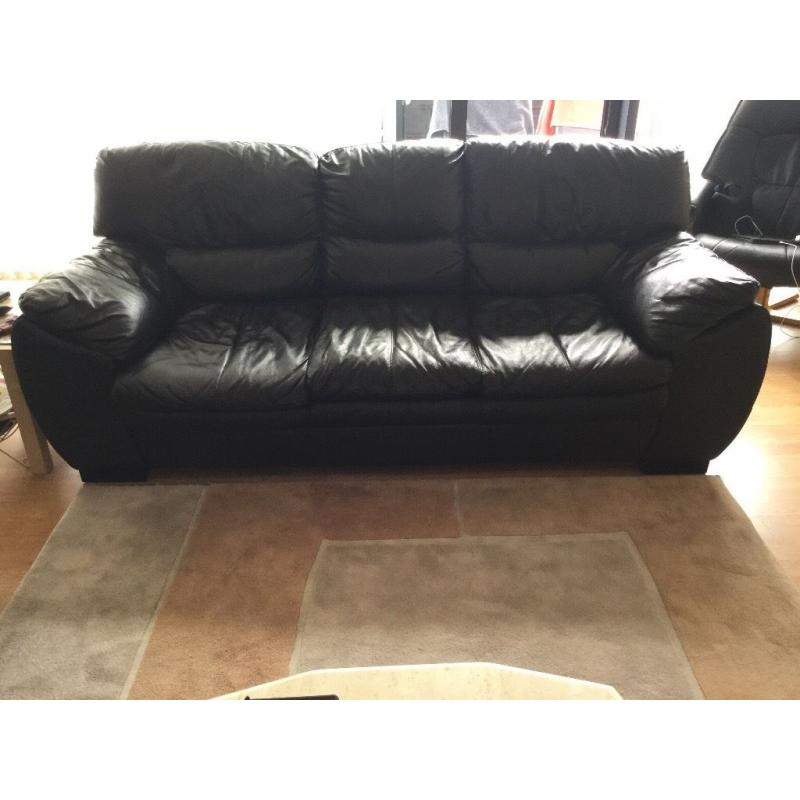 Two black leather sofas three seater and two seater good condition.
