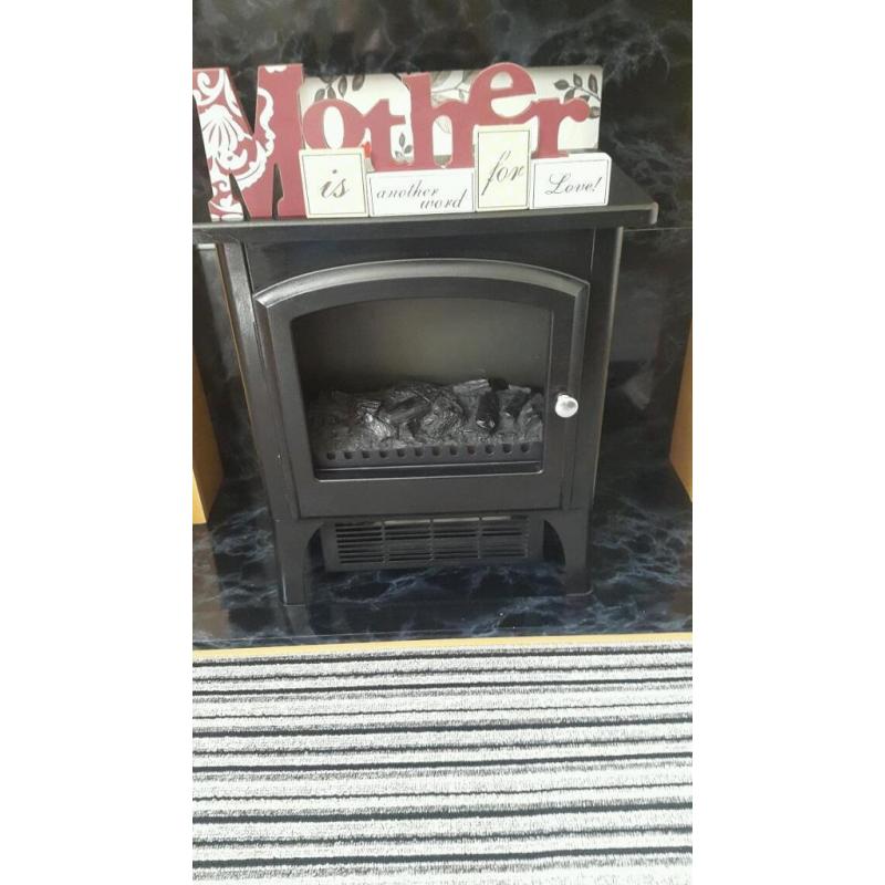 Fire surround and half complete with log burner