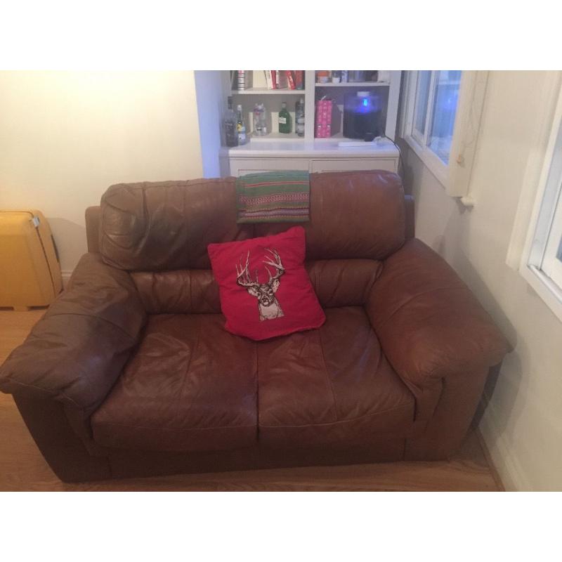 Two seater brown leather sofa