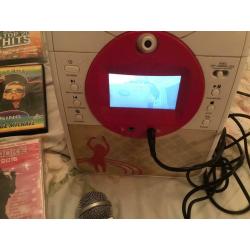 KARAOKE MACHINE WITH TV SCREEN AND DVDS, ALL WORKING ORDER, GRAB A BARGAIN