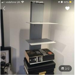 Floating metal bookcase